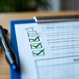 Checklist with approved checkmarks representing loan eligibility